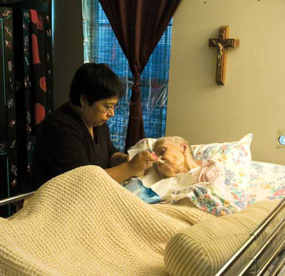 Juana Martinez is taken care of by her daughter, Cecilia Vega