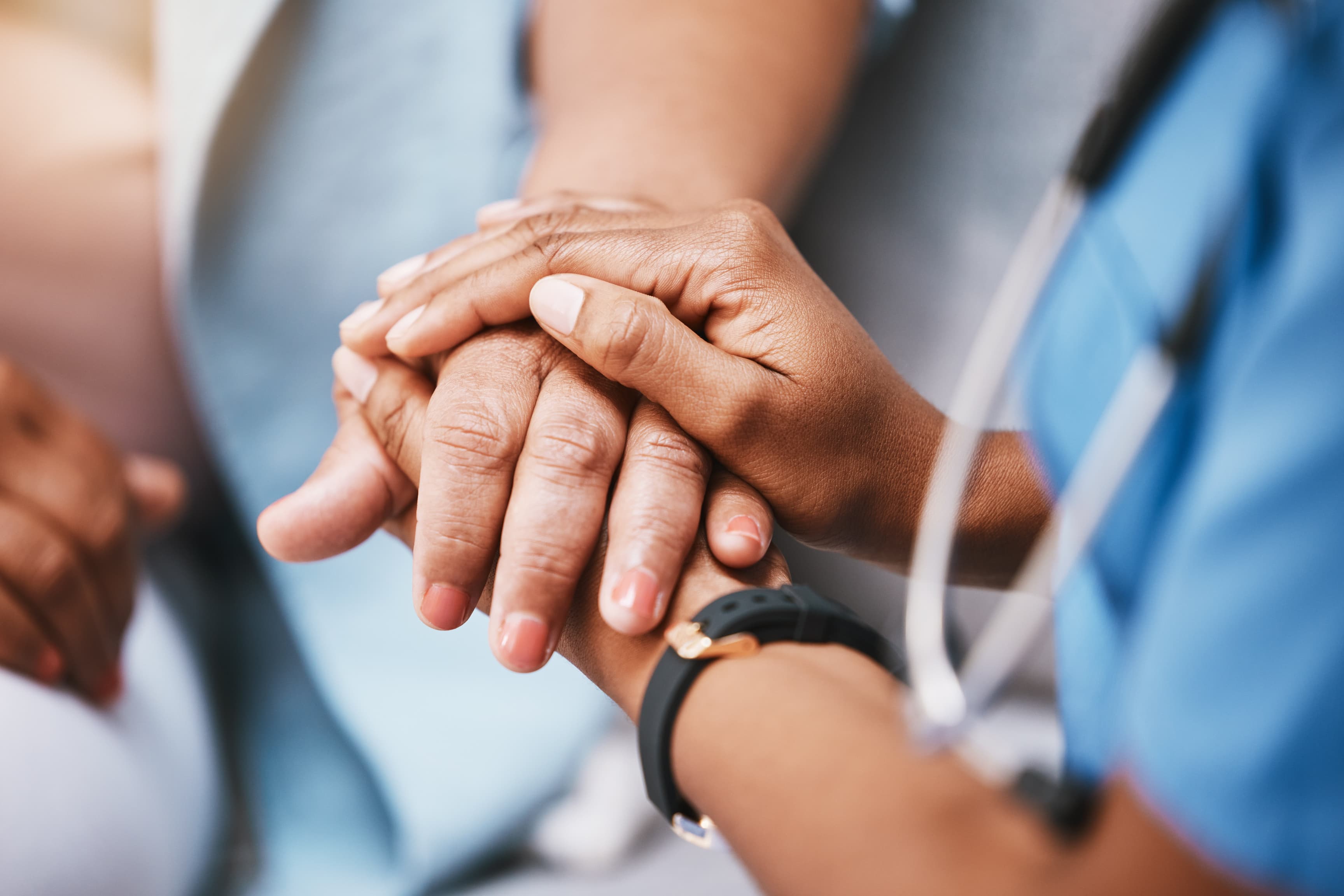 Two people holding hands