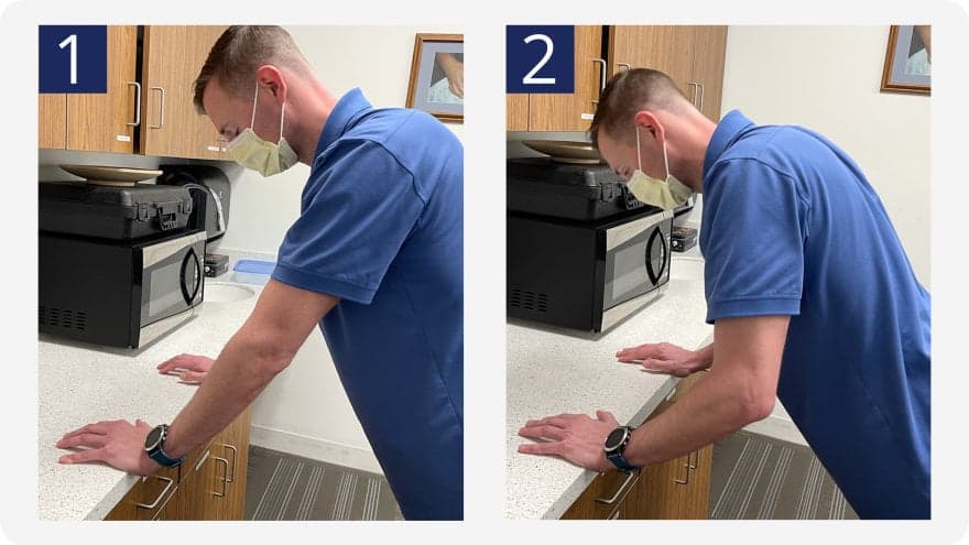 2 step guide to performing an elevated pushup against a kitchen counter at an incline.