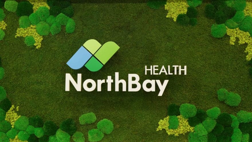 The NorthBay Health logo surrounded by green moss and micro-grasses of various shades.