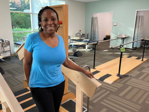 Alisa Duncan smiling at the camera inside NorthBay's physical therapy suite.