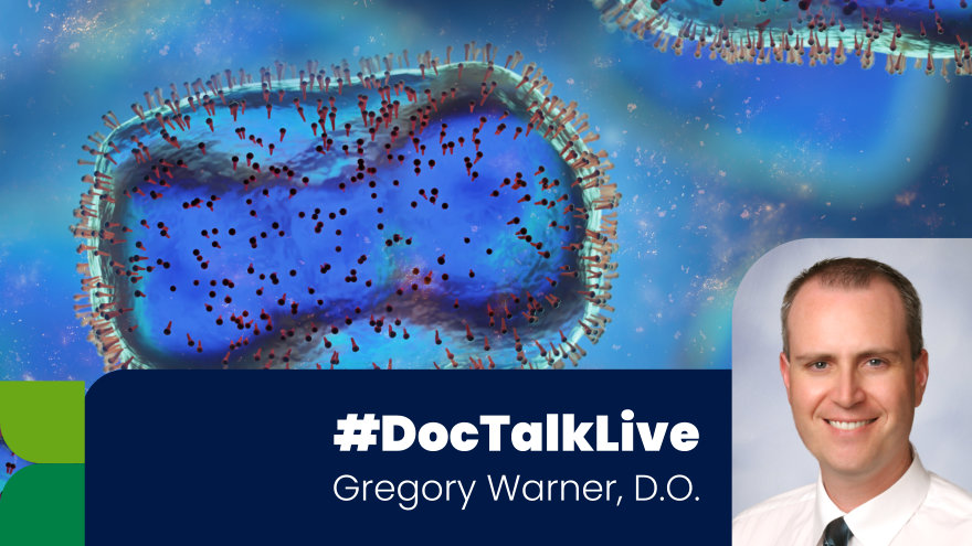 A picture of Dr. Warner in the bottom-right with the text #OurDocTalk and his name in white on a dark blue curved rectangle. An up close and stylized microscope image of a virus in different shades of blue appear in the background. 