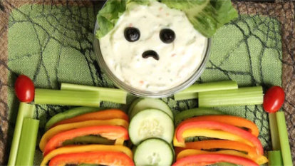 Various vegetables used to arrange a skeleton form. The head of the skeleton is ranch for dipping.