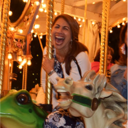 A group of attendees enjoying themselves on the carousel right at the Nut Tree Plaza.