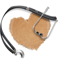 Stethoscope draped around a cardboard heart.