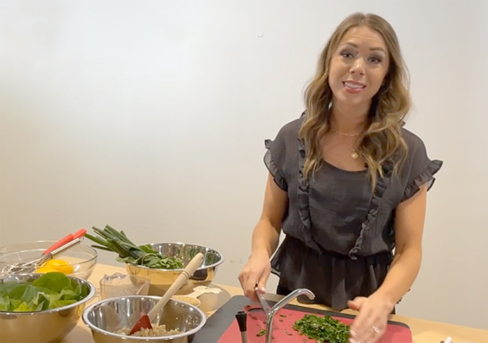 Dietitian Laura O’Mary chops parsley, part of the Tabbouleh, during her cooking demonstration on Facebook.