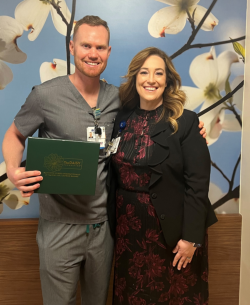 New DAISY Award winner Scott Greathouse, R.N., poses for a photo with Vice President and Chief Nursing Officer Heather Resseger.